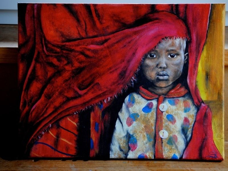 Bambino Africano Sotto Un Tappeto Rosso