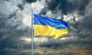Ukraine Flag. Ukrainian Flag On Black Storm Cloud Sky. Stormy Weather