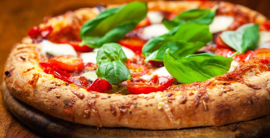 Italians and pizza: the specialty and excellence served on the table