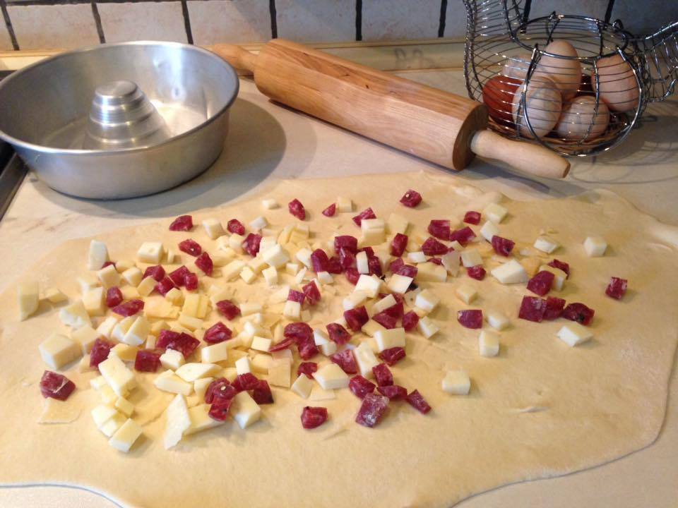 casatiello dough spread with stuffing