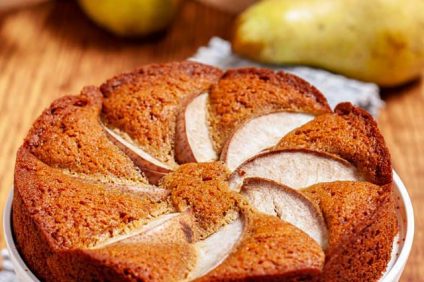 Muscovado cake with pears and rum on a backsplash