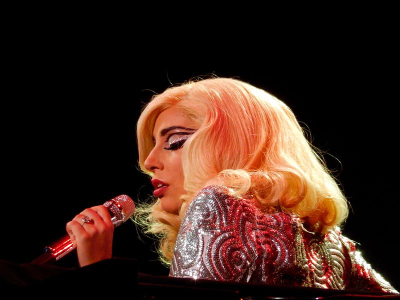 Lady Gaga- the pop star sings into the microphone