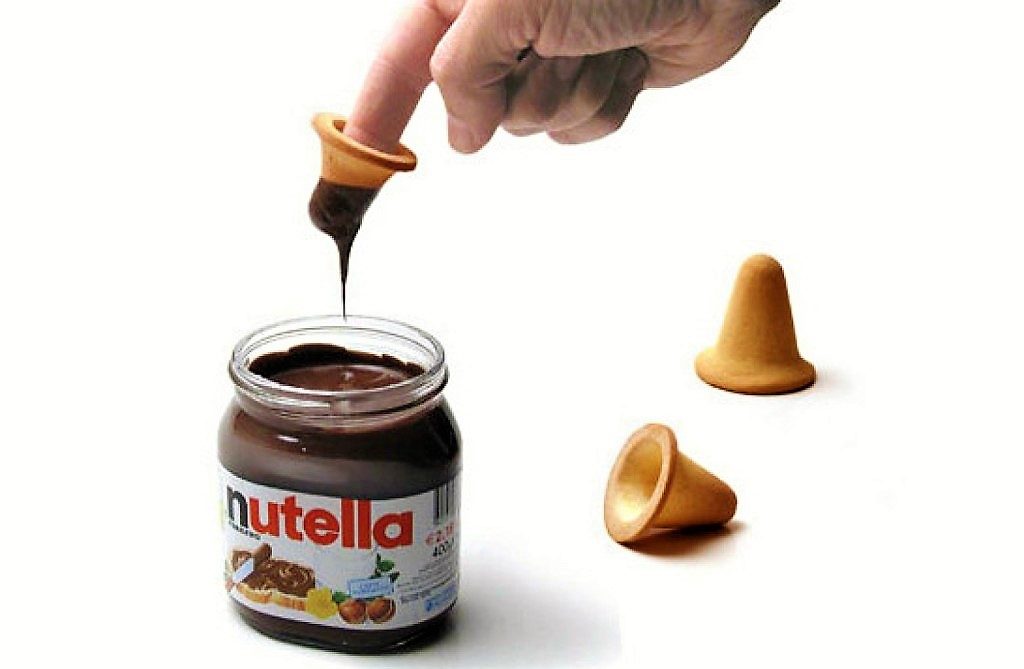 Nutella Finger biscuits - man dipping his finger in Nutella
