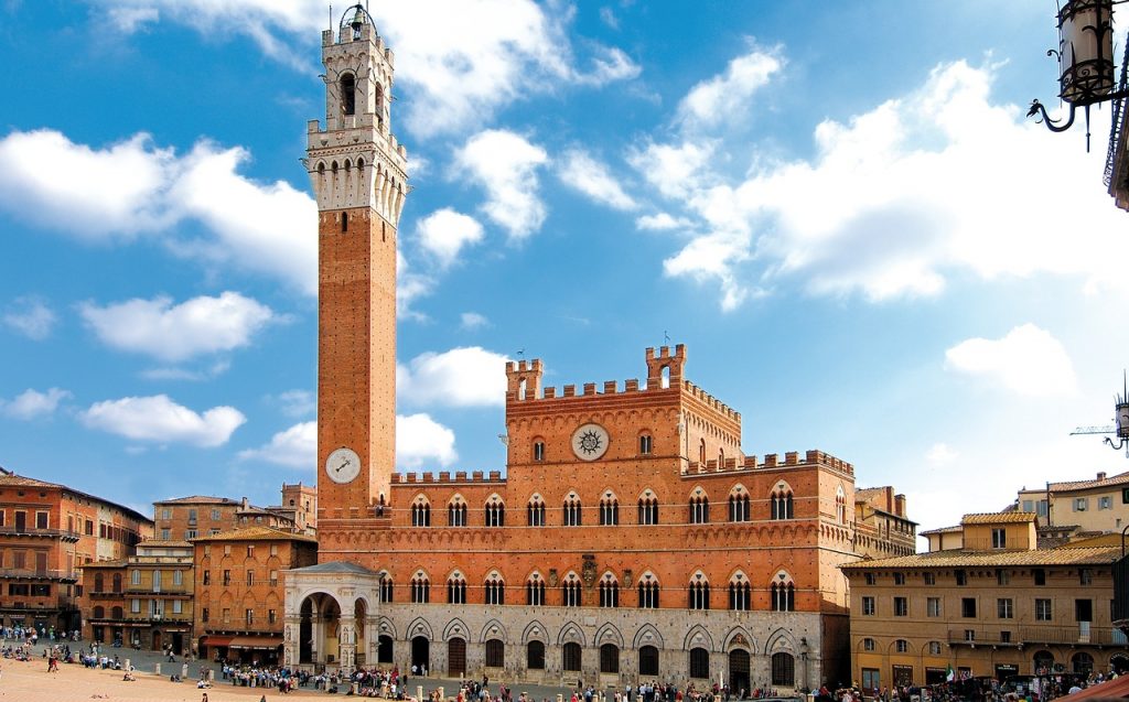 Siena. Piazza del Campo with the first floor of the town hall and civic tower in red brick