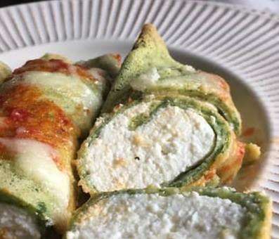 close-up of ricotta and spinach crepes cannelloni