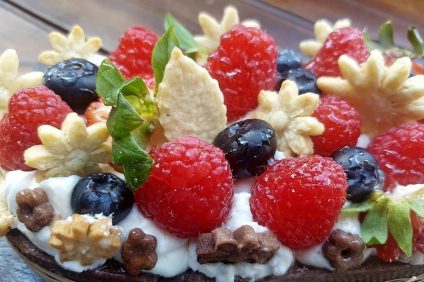 sweet pastry with cream and fruit on top