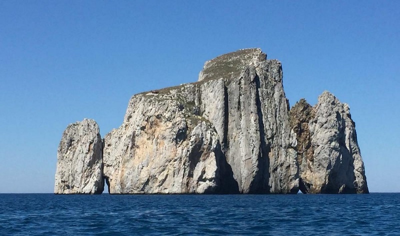 The stacks called Pan di Zucchero, facing the beach of Porto Flavia