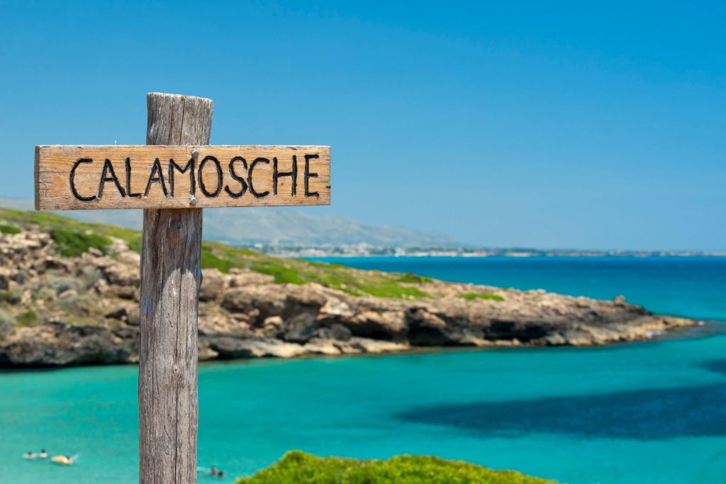 Calamosche beach is located between two rocky promontories