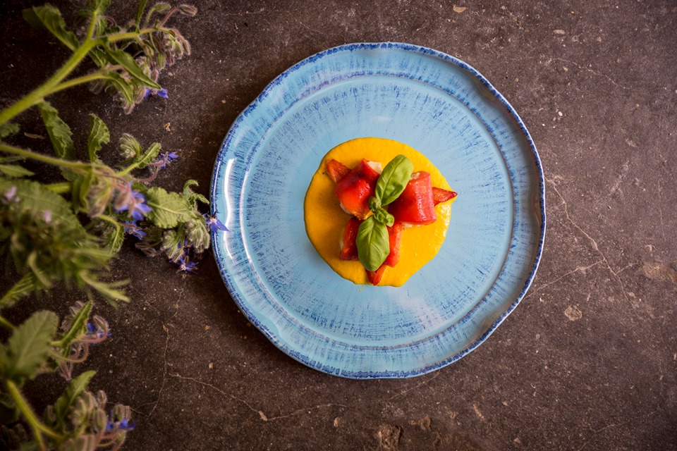 Rolls of peppers stuffed with perch viewed from above