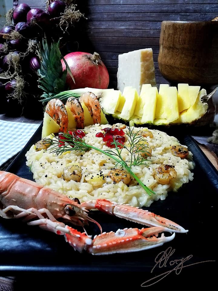 composition of Risotto with pineapple prawns and scented prawns with brandy