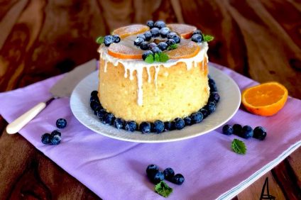 plate with Chiffon cake with orange, white chocolate and blueberries