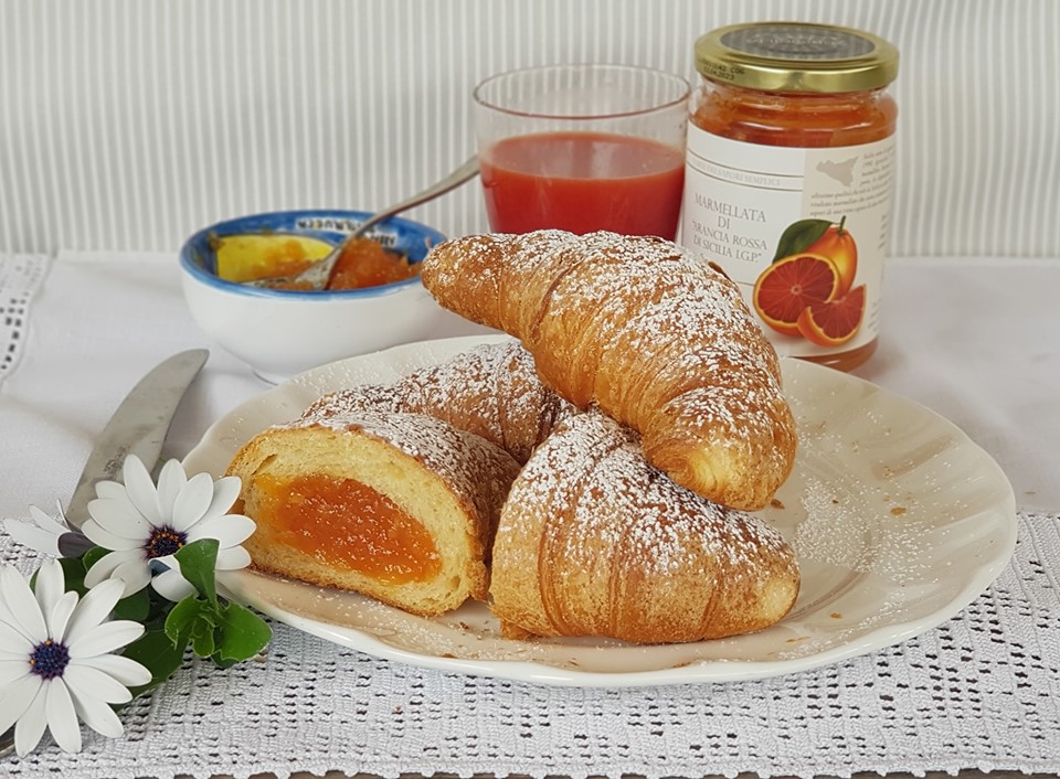 croissants with jam on a plate