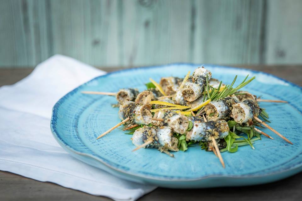 gratinated sardines with rosemary closed with toothpicks