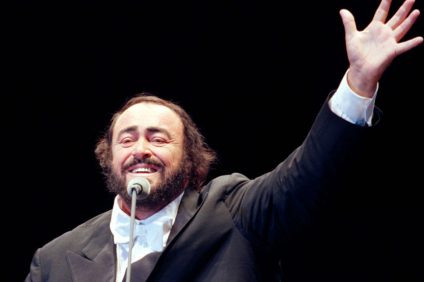 Luciano Pavarotti on stage greeting the audience