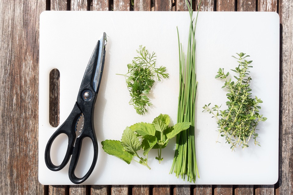 spices, smells and clover on white cutting board