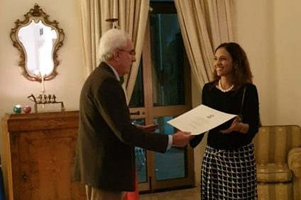 Knight- Paola Stranges receives the award from the Italian Ambassador Mario Sammartino