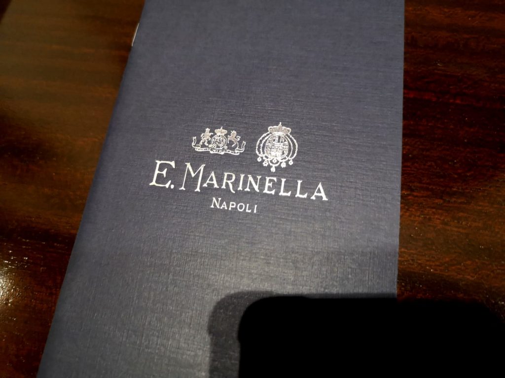 E. Marinella - blue brochure with silver colored writing