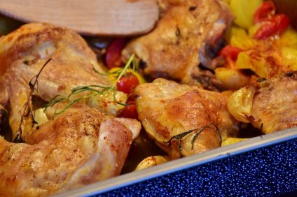 chicken and potatoes in a baking dish
