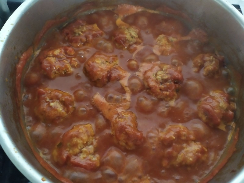 aucepan with meatballs in the sauce