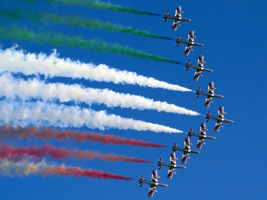 Italians. Tricolor arrows dart across the sky