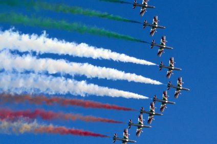 Italians. Tricolor arrows dart across the sky