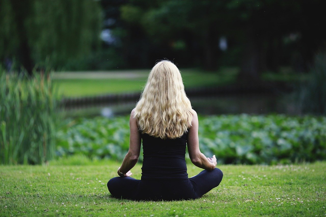mindfulness girl meditating from behind