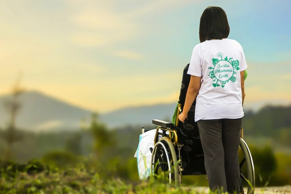 Nurse Antonella - a woman is assisting an elderly person