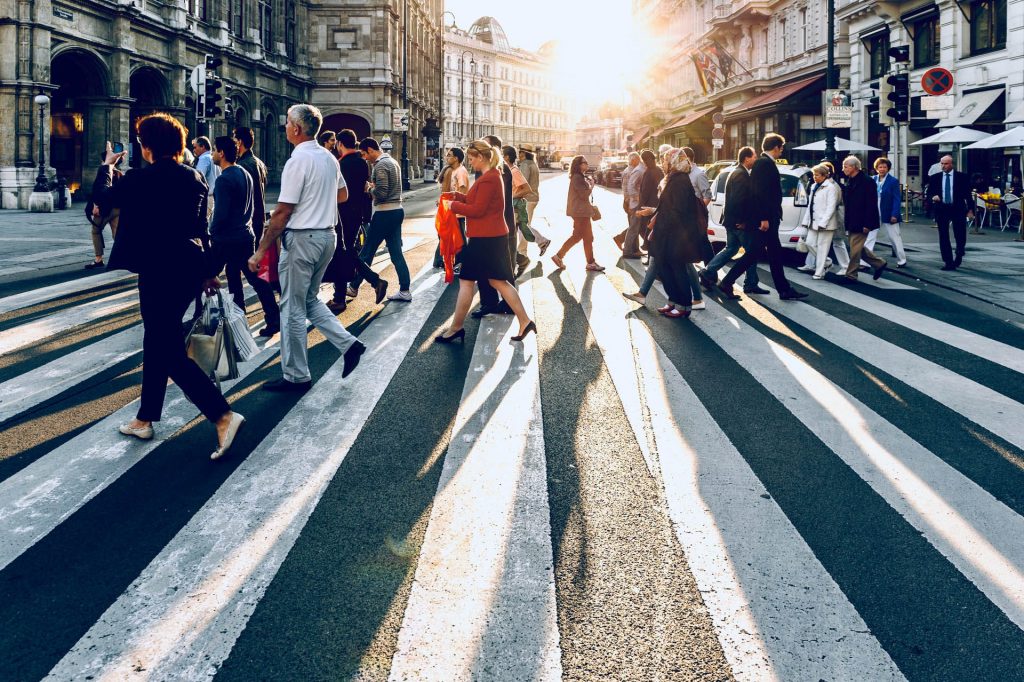 crowd- many people crossing the street