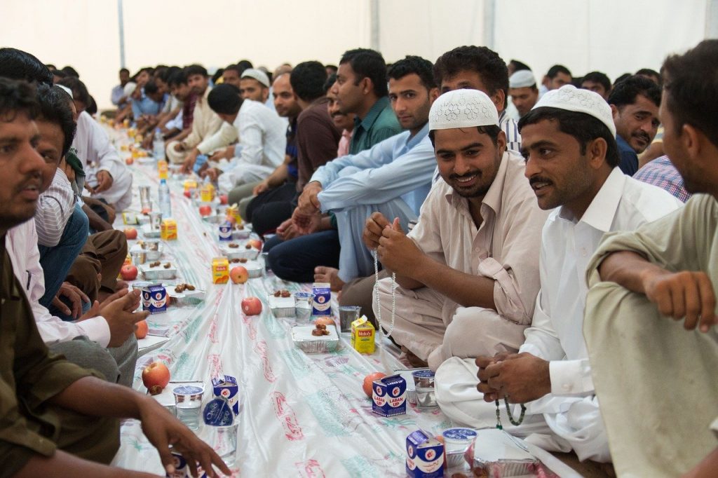 ramadan - a group of muslims during lunch