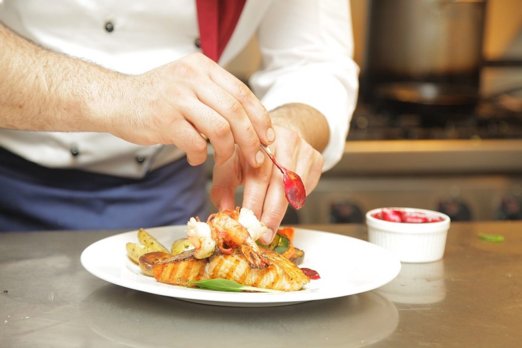 restaurateurs - a chef preparing a dish