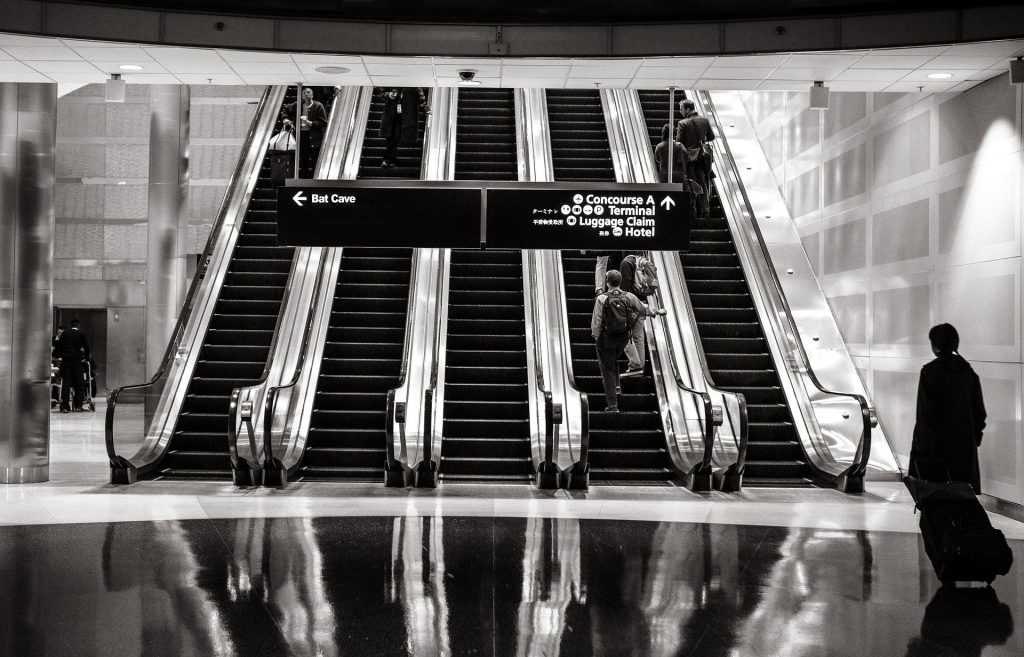 Giada - black and white photo of escalators