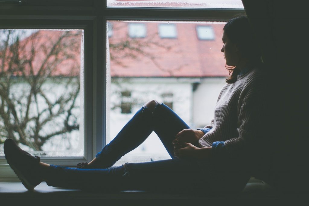 lockdown - a girl sitting on a balcony - habits