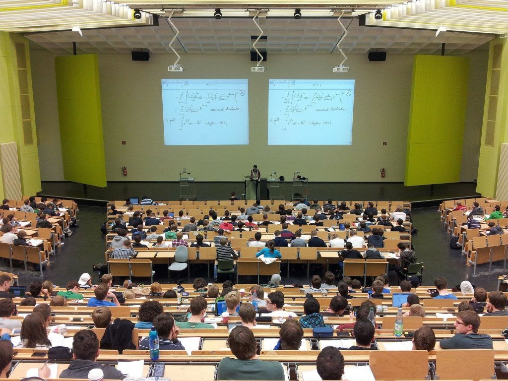 university classroom with students and professors