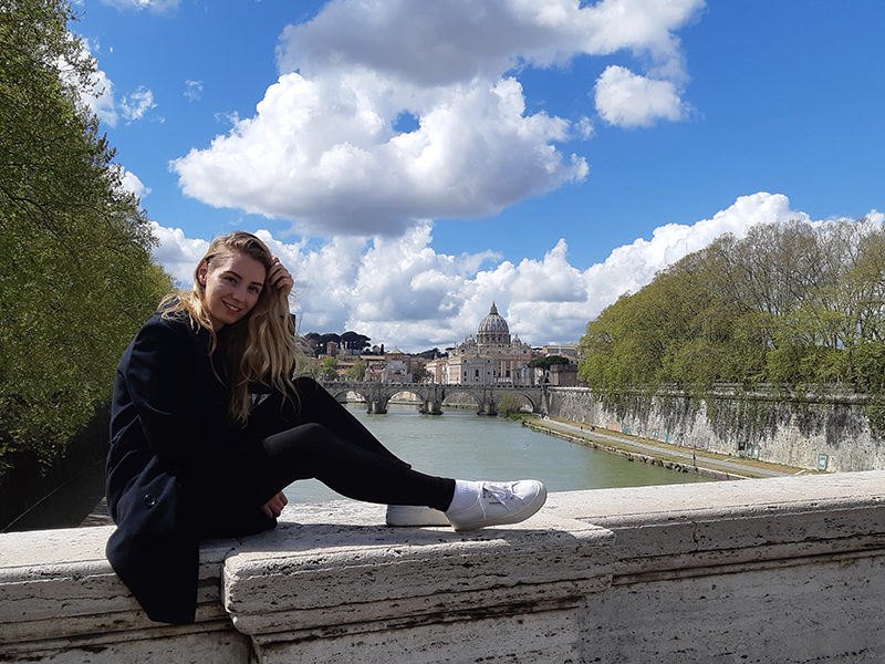 Italy - Anna sitting on a bridge