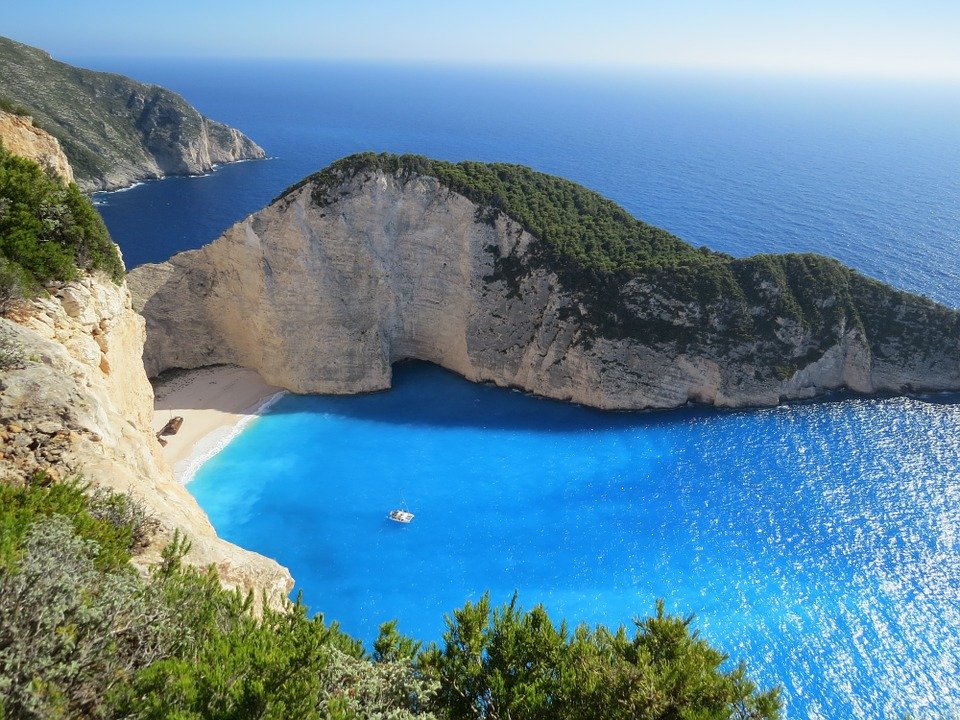 blue flags - bay surrounded by the sea