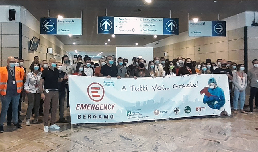 field hospital - doctors and patients with banner greet and thank emergency