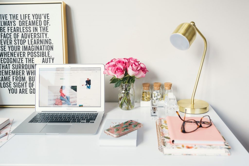 case - desk, gold lamp, pc, picture and vase with roses