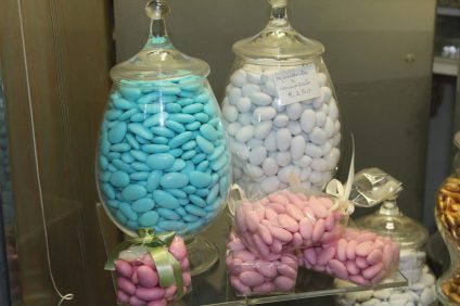 colored sulmona sugared almonds in glass jars