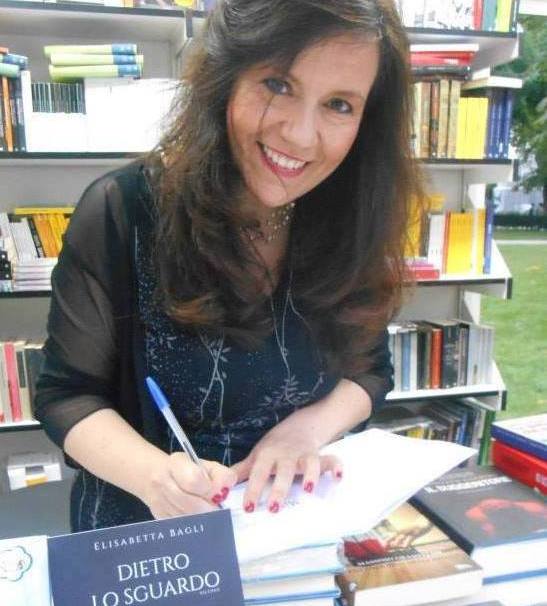 Elisabetta Bagli signs one of her books