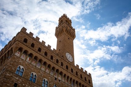 view of the tower with clock Palazzo Vecchio in Florence