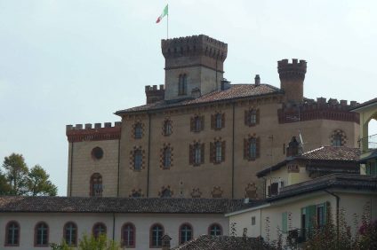 Barolo Castle - View of the Castle with the Italian flag