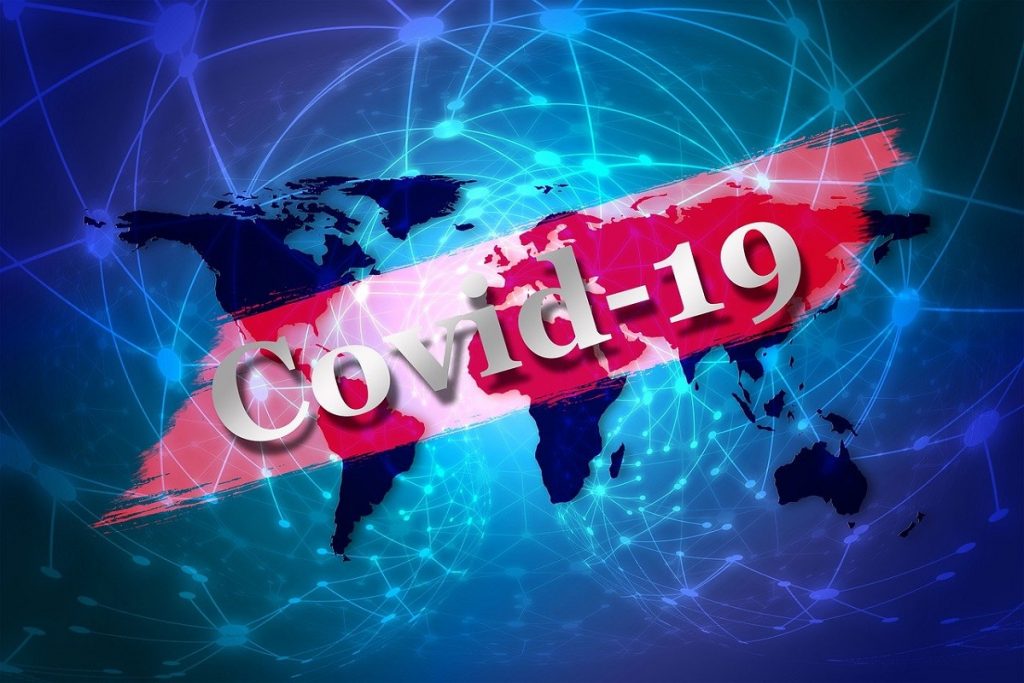Contagi: il Covid 19 scritta bianca su banner rosso- Foto: Pixabay